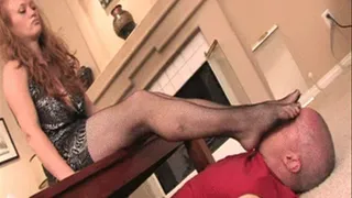 Mistress Tyler smothers and gags her stockings feet into the mouth of her foot slave under her table