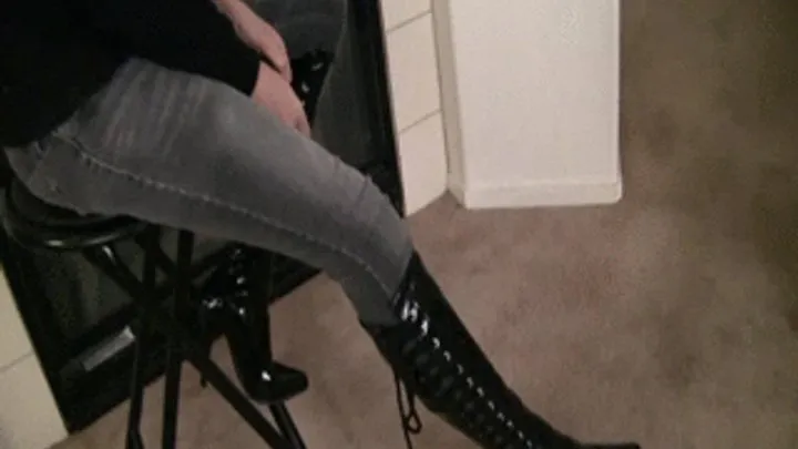 Mistress Tiffany gags her boot heels into the mouth of her slave