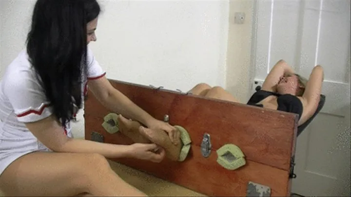 Holly and Jane Take Turns In The Stocks!