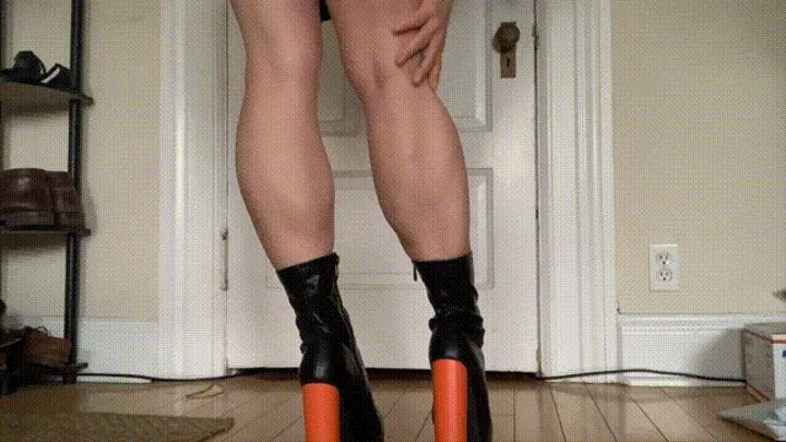 Calves Show Off in Black and Orange Ankle Boots