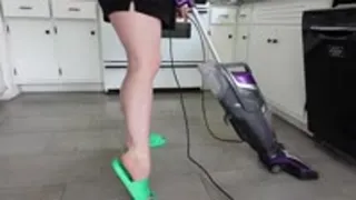 Muscular Calves while Vacuuming in Green Slides