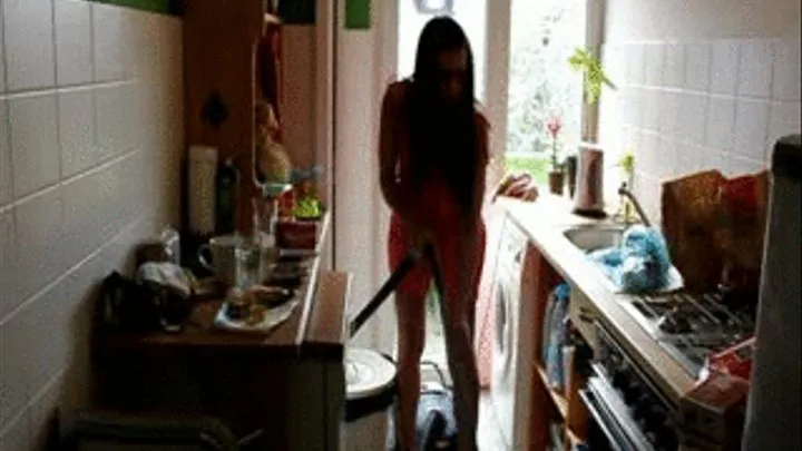 Corall Hoovering in the kitchen