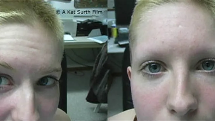 Woman with short hair shaving off her eyebrows