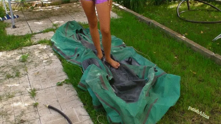 Christina pumps a rubber boat in purple wet look swimsuit