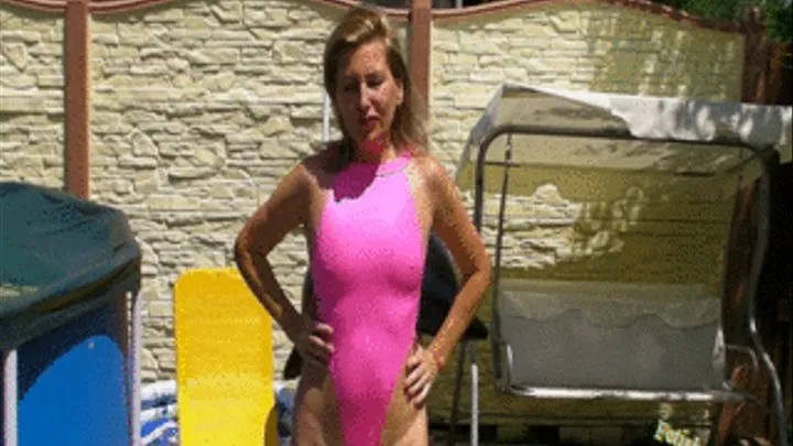 Alina in pink Spandex Swimsuit pumps up a mattress with rubber foot pump