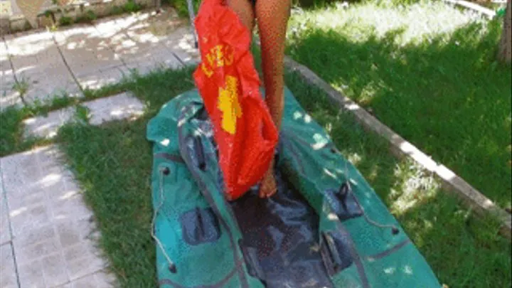 Christina is blowing up Life Vest and pumps up rubber boat with rubber foot pump outdoors