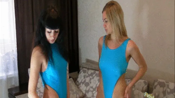 Christina and Nikki in blue swimsuits blowing up life vests and arm wings
