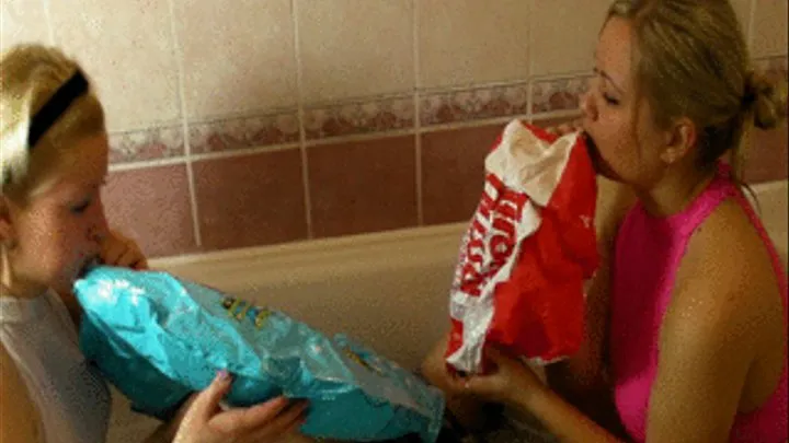 2 blondes in the bathtub with toys