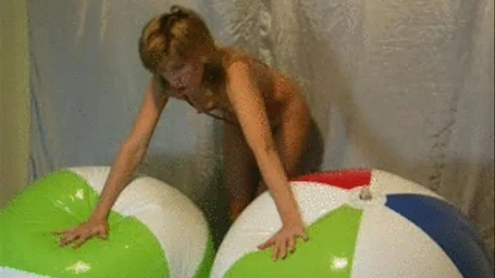 Topless Alina deflates her beachball