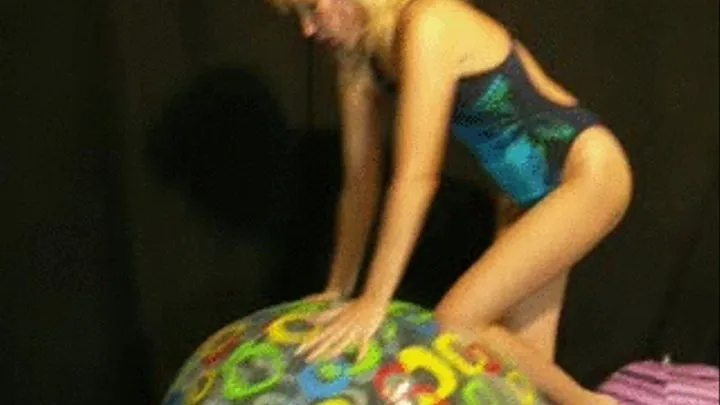 Alina in swimsuit deflates beachball