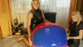 2 blondes deflating the double valve beachball