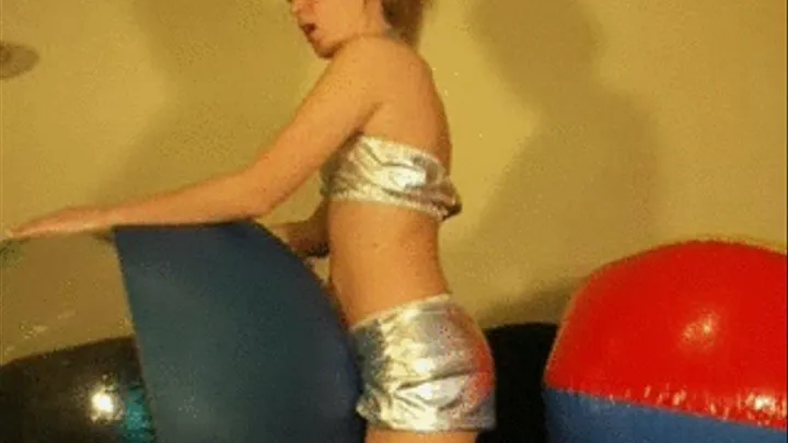 Alina riding big beachballs