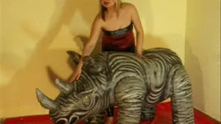 Christina rides a rhino in Spandex