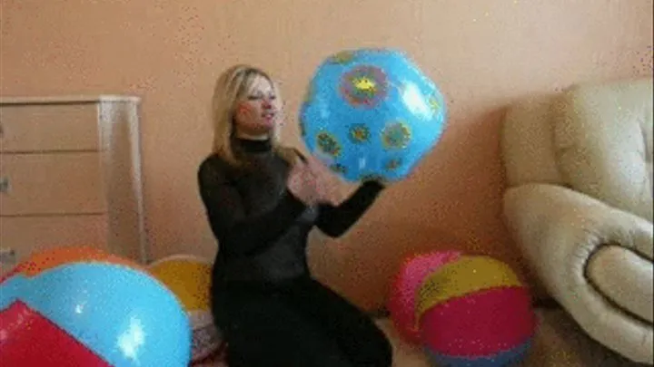 Christina in Jeans pops a beachball