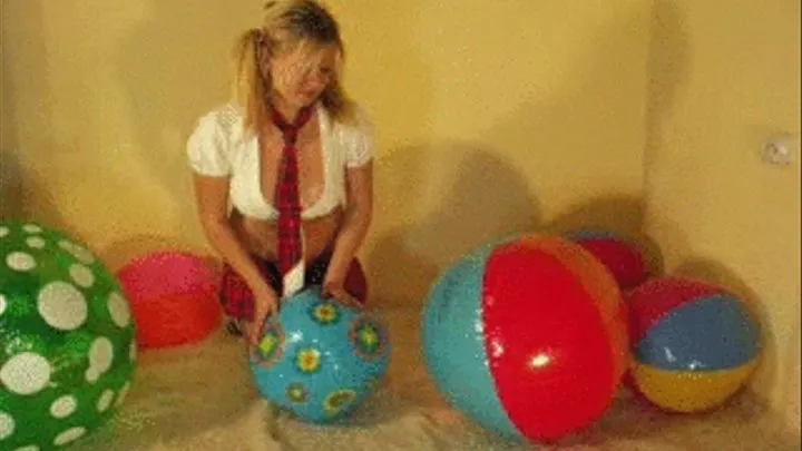 Christina as a schollgirl plays with beachballs