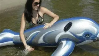 Jackie riding dolphin