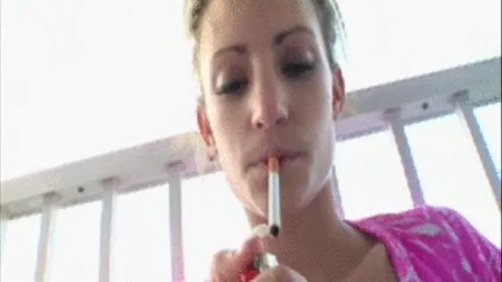 Cheyenne smoking a menthol cigarette popping balloons on balcony IPHONE File