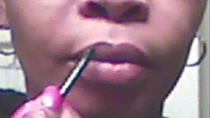 Extreme Close-Up Of Lipstick Application