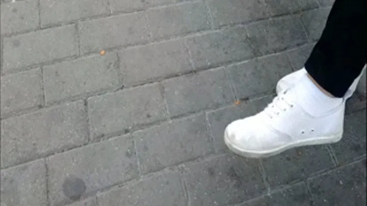 Dirty White Sneakers At Bus Stop In Eastern Germany