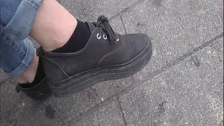 Close Up To Black Socks In Black Sneakers