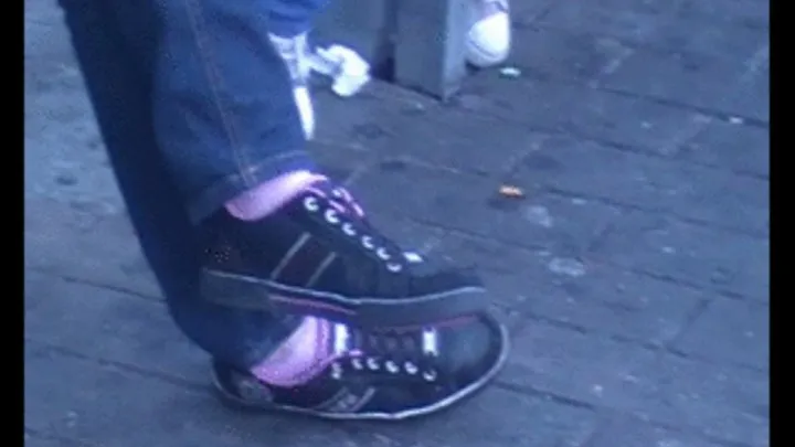 Black sneakers with pink socks