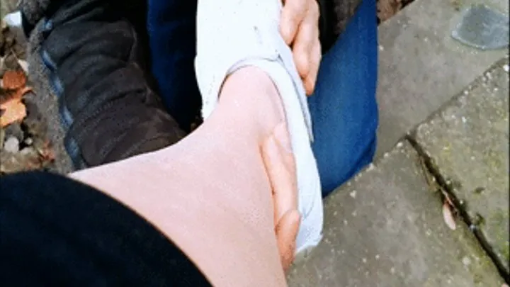 White sneakers barefeet touching