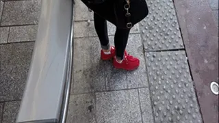 Beautiful French Lady With Red Sneakers Looking To You