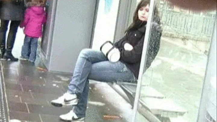 French girl's Nike sneaker play at the bus stop