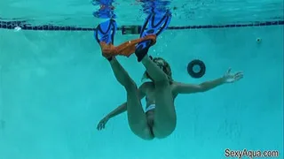 Underwater MILF flips in her booty shorts