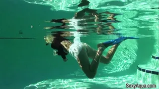 Snorkel girl underwater in her skirt