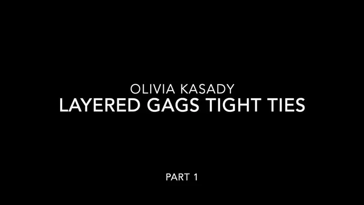 Olivia Kasady in Layered Gags and Tight Ties