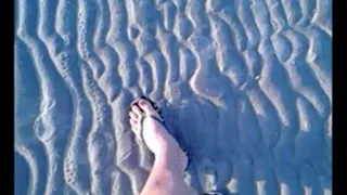 I walk along the sand in flip-flops. flf