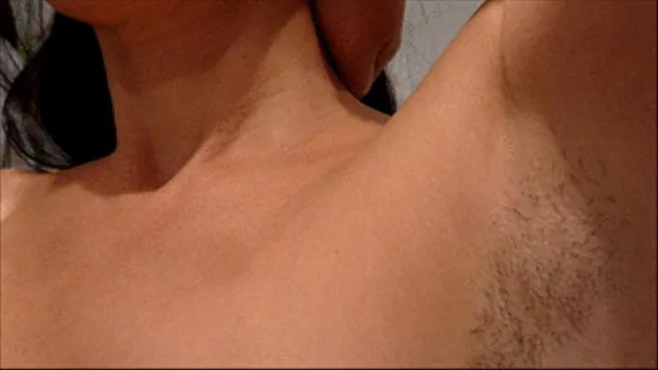 Shaving hairy armpits. a