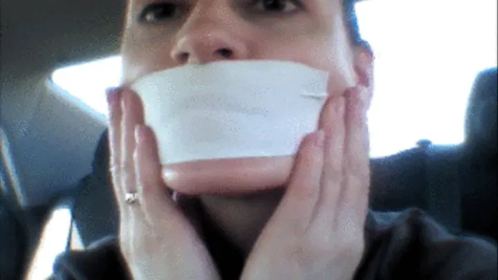 In the car, the tape on her mouth and ...