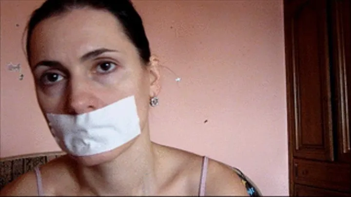 a video with tape over mouth.