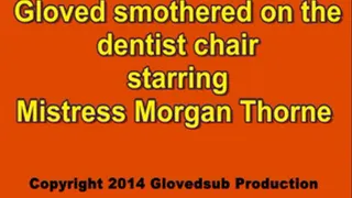 Gloved handgagged on the dentist chair