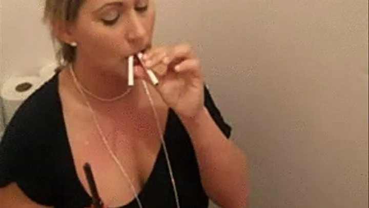 Two Cigarettes On The Toilet