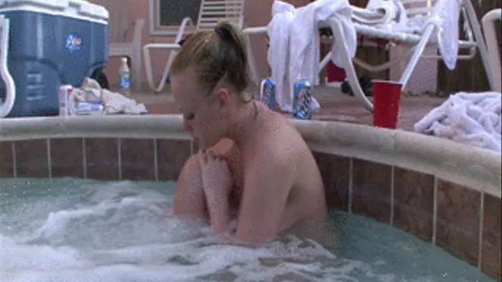 young blonde with huge tits in the hot tub daytime