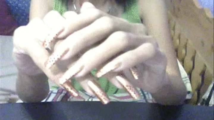 Gold square nails close up