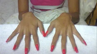 Neon red nails in flat surface