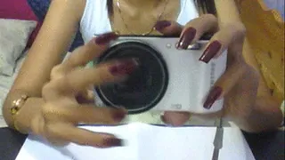 Square maroon nails and digicam