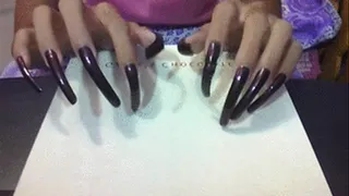 Sexy dark brown nails tapping..