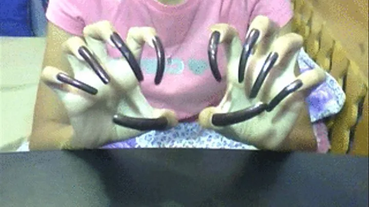 Sexy dark brown nails scratching air..