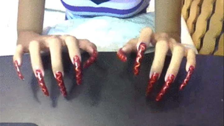 red and zigzag design nails tapping..