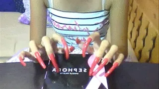 fuschia orange nails tapping..