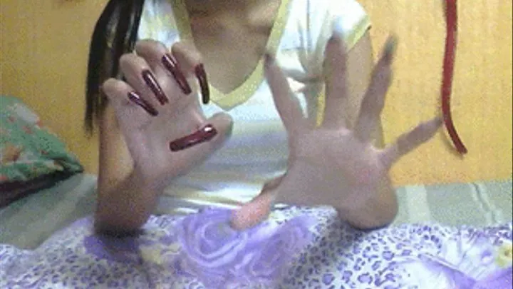 Dark red nails scratching air