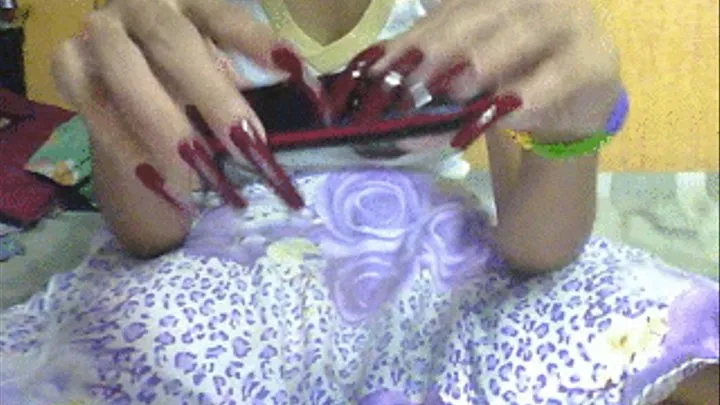 Dark red nails and mobile