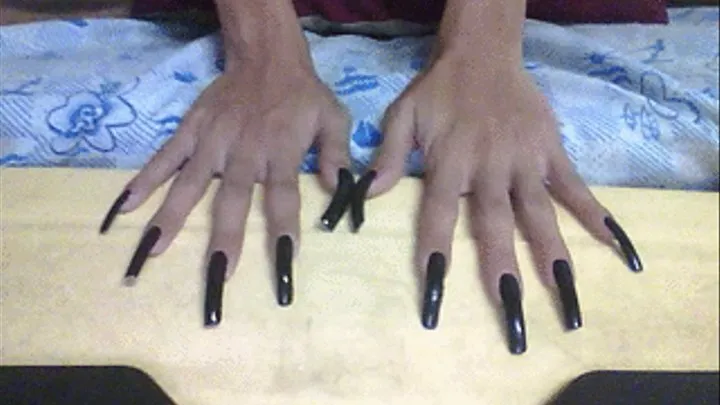 Shiny black nailss in table