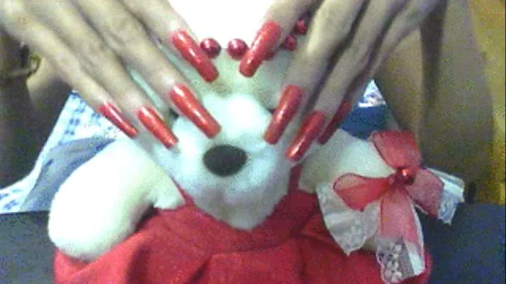 Glittery red nails and stuff toy