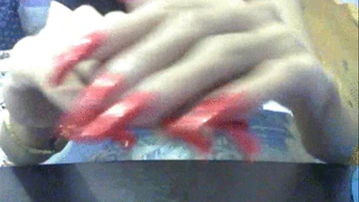 Glittery red nails close up